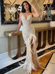 VC Nude Strapless Crystals Embellished Long Dress Sheath Low V Neck Sleeveless Feather High Side Slit Floor Length Evening Gown