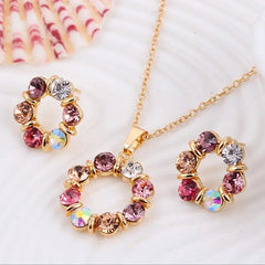 Necklace with circular pendant featuring multicolored gemstones on a white background
