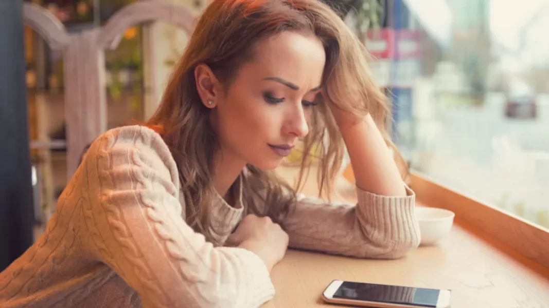 woman checking her phone